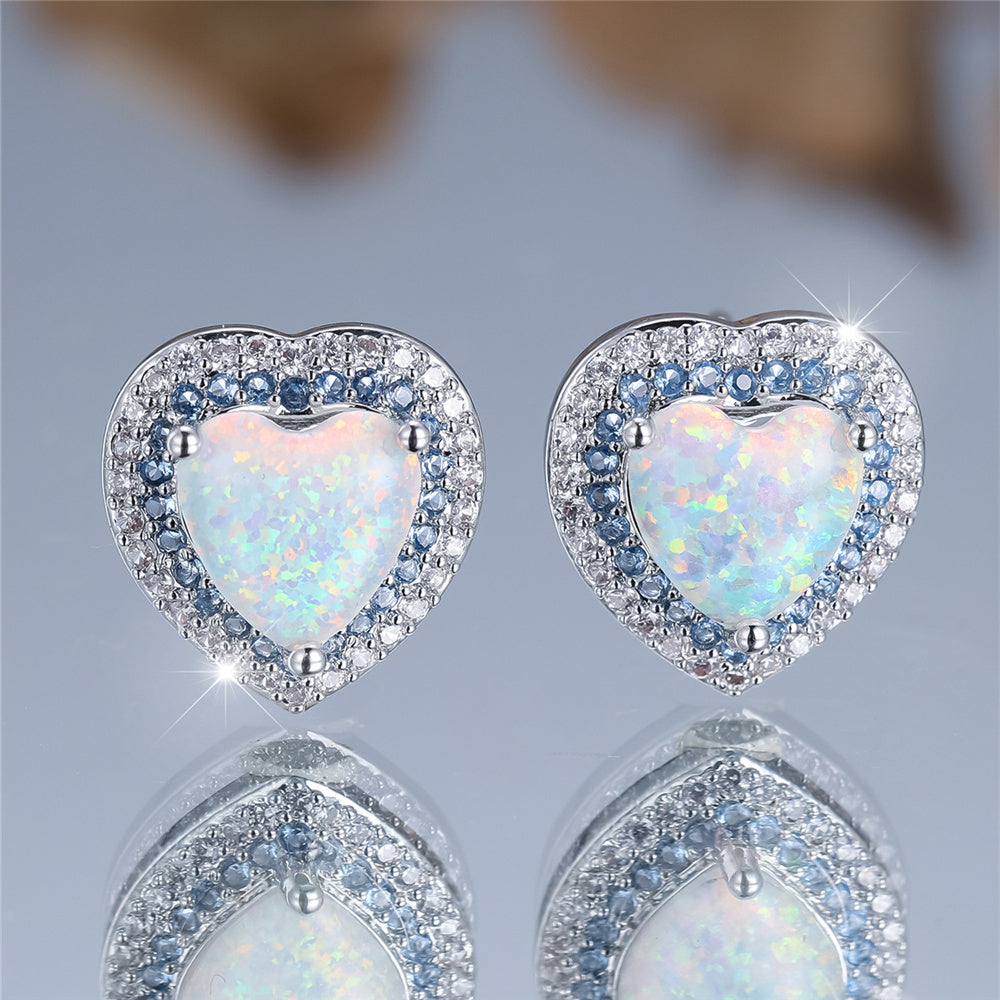 A pair of elegant and luxurious heart-shaped synthetic jade earrings for women as a wedding, party or jewelry gift.