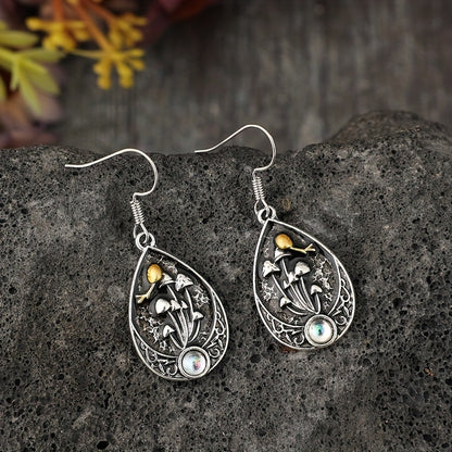 A pair of retro moonstone teardrop mushroom stud earrings, fashionable alloy drip earrings, with artificial analog gemstones and iron ear needles, suitable for women, suitable for over 15 years old
