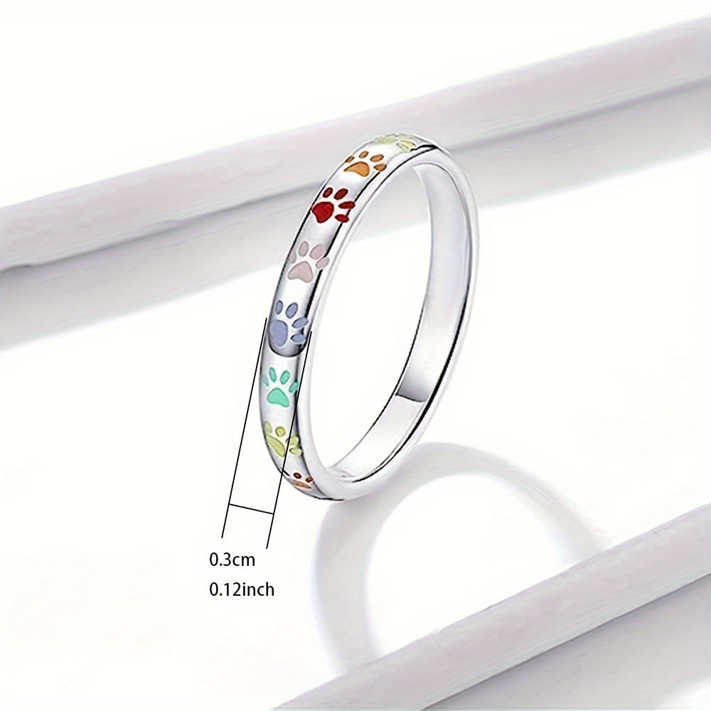 Adorable band ring engraved dog paw on the surface silver or black allows your phone to match everyday clothing suitable for both men and women