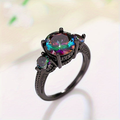 The stylish ring set with sparkling gemstones reflects the colorful lights, symbolizing mystery and beauty as the perfect anniversary/birthday gift for your loved one
