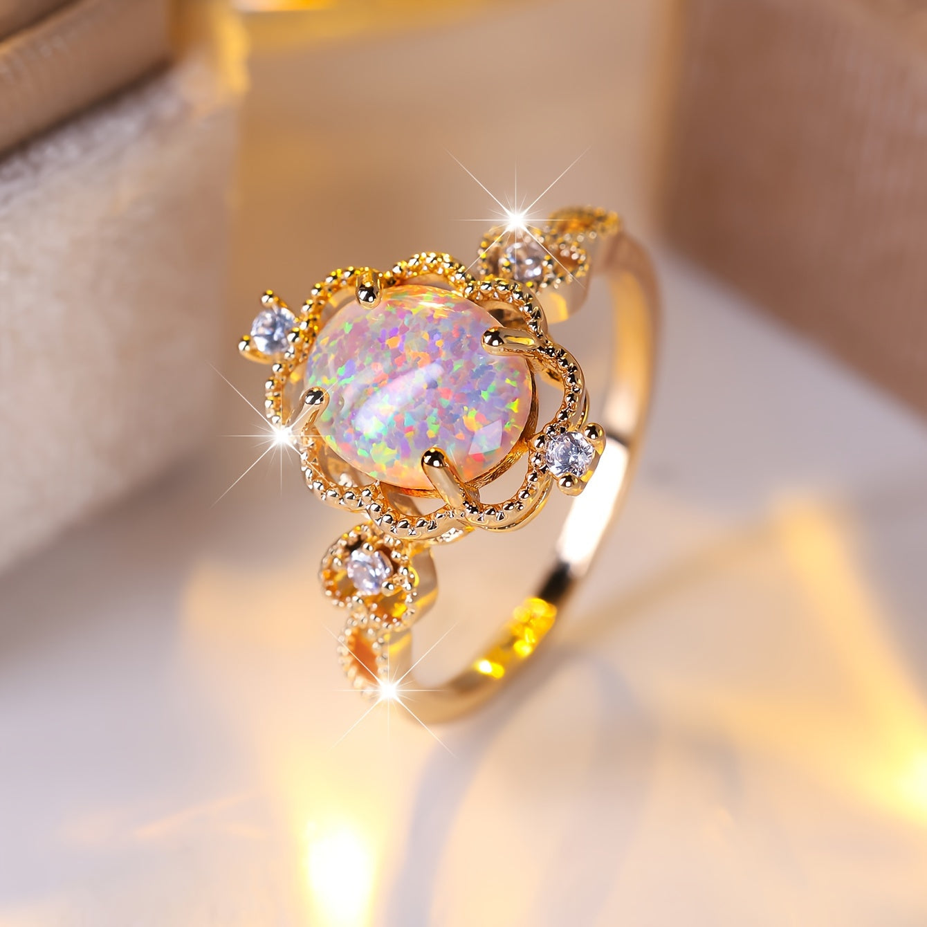 An elegant bohemian-style copper engagement ring with white synthetic opal and cubic Zirconia trim and gold-plated jewelry for weddings and parties