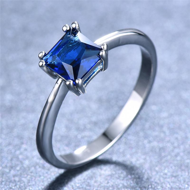 Jewelry gifts showcase square rings in different colors, such as white, blue, pink, and green, designed for Women's fashion and wedding rings.