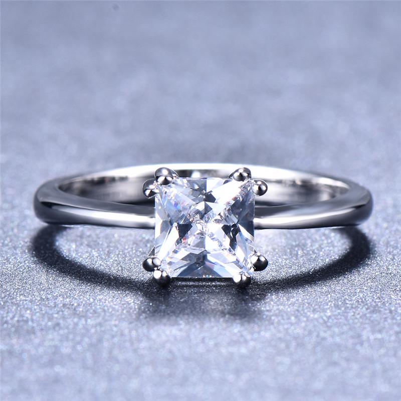 Jewelry gifts showcase square rings in different colors, such as white, blue, pink, and green, designed for Women's fashion and wedding rings.