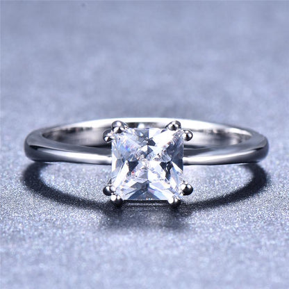 Jewelry gifts showcase square rings in different colors, such as white, blue, pink, and green, designed for Women's fashion and wedding rings.