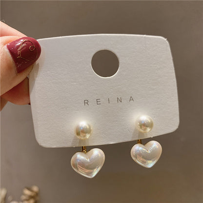 1 pair of classic heart-shaped imitation pearl stud earrings, anti-allergic platinum-plated alloy with acrylic inlay
