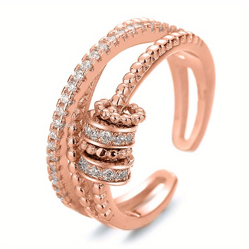 An Adjustable Rotary Anxiety Ring - French Holiday Style Declaration Ring with Cubic Zirconia - Copper Spiral Cross Design - Unisex Carnival Holiday Jewelry for Everyday and Party Occasions - April Birthstone Jewelry - Synthetic Gemstones