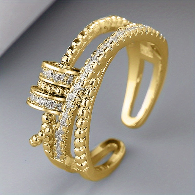 An Adjustable Rotary Anxiety Ring - French Holiday Style Declaration Ring with Cubic Zirconia - Copper Spiral Cross Design - Unisex Carnival Holiday Jewelry for Everyday and Party Occasions - April Birthstone Jewelry - Synthetic Gemstones