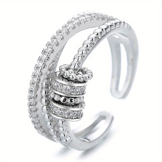 An Adjustable Rotary Anxiety Ring - French Holiday Style Declaration Ring with Cubic Zirconia - Copper Spiral Cross Design - Unisex Carnival Holiday Jewelry for Everyday and Party Occasions - April Birthstone Jewelry - Synthetic Gemstones