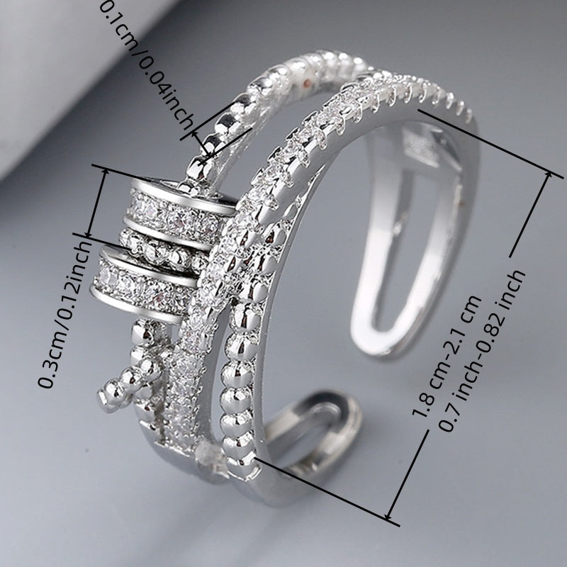 An Adjustable Rotary Anxiety Ring - French Holiday Style Declaration Ring with Cubic Zirconia - Copper Spiral Cross Design - Unisex Carnival Holiday Jewelry for Everyday and Party Occasions - April Birthstone Jewelry - Synthetic Gemstones