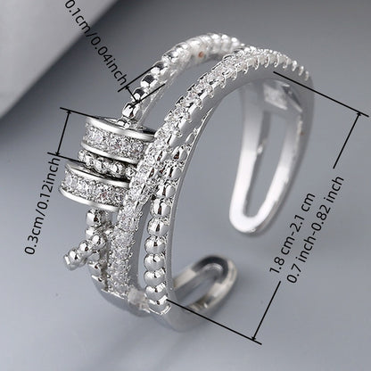 An Adjustable Rotary Anxiety Ring - French Holiday Style Declaration Ring with Cubic Zirconia - Copper Spiral Cross Design - Unisex Carnival Holiday Jewelry for Everyday and Party Occasions - April Birthstone Jewelry - Synthetic Gemstones