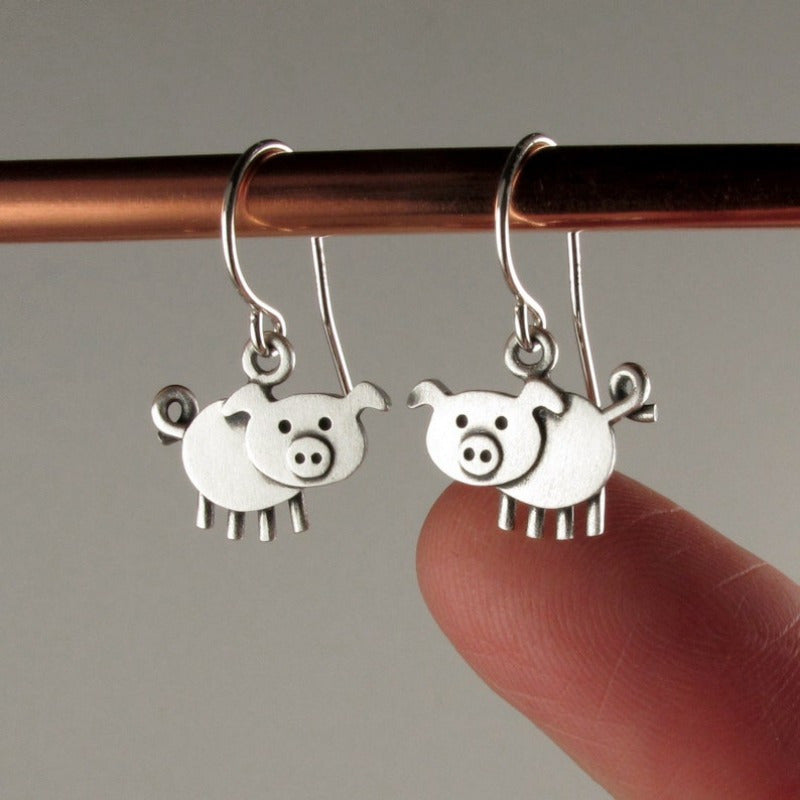 A pair of bohemian vintage pig-shaped pendant earrings, 925 silver-plated copper hooks, and charming animal jewelry for Casual Attire and gift giving, perfect for the Christmas season.