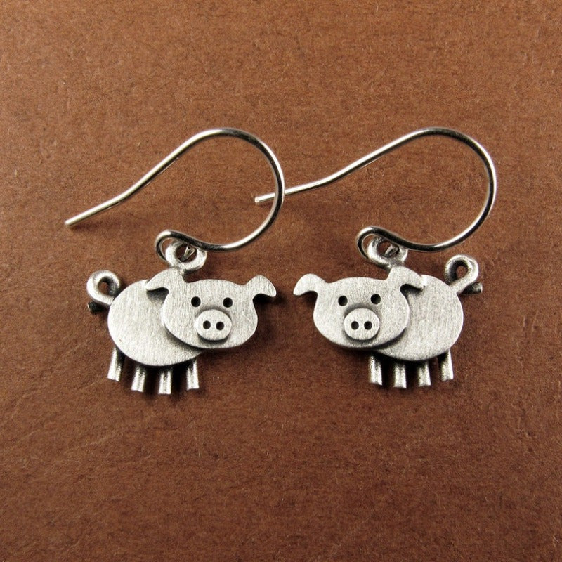 A pair of bohemian vintage pig-shaped pendant earrings, 925 silver-plated copper hooks, and charming animal jewelry for Casual Attire and gift giving, perfect for the Christmas season.