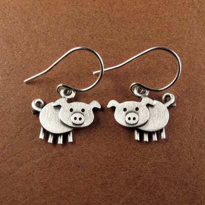 A pair of bohemian vintage pig-shaped pendant earrings, 925 silver-plated copper hooks, and charming animal jewelry for Casual Attire and gift giving, perfect for the Christmas season.