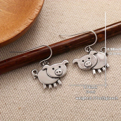 A pair of bohemian vintage pig-shaped pendant earrings, 925 silver-plated copper hooks, and charming animal jewelry for Casual Attire and gift giving, perfect for the Christmas season.
