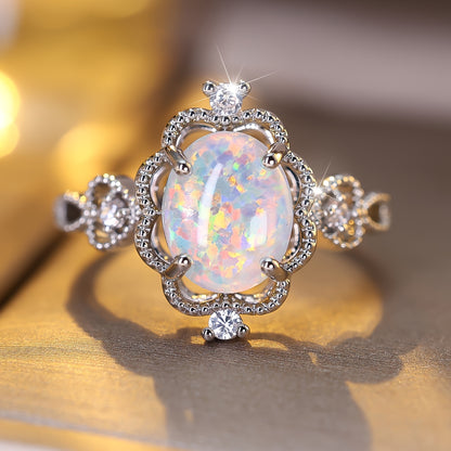 An elegant bohemian-style copper engagement ring with white synthetic opal and cubic Zirconia trim and gold-plated jewelry for weddings and parties
