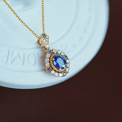Elegant vintage style engagement and wedding necklace with oval blue synthetic gemstone - the perfect anniversary gift for her