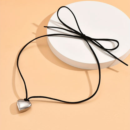 Silver heart-shaped irregular necklace, with retro irregular black necklace to show high-cold temperament