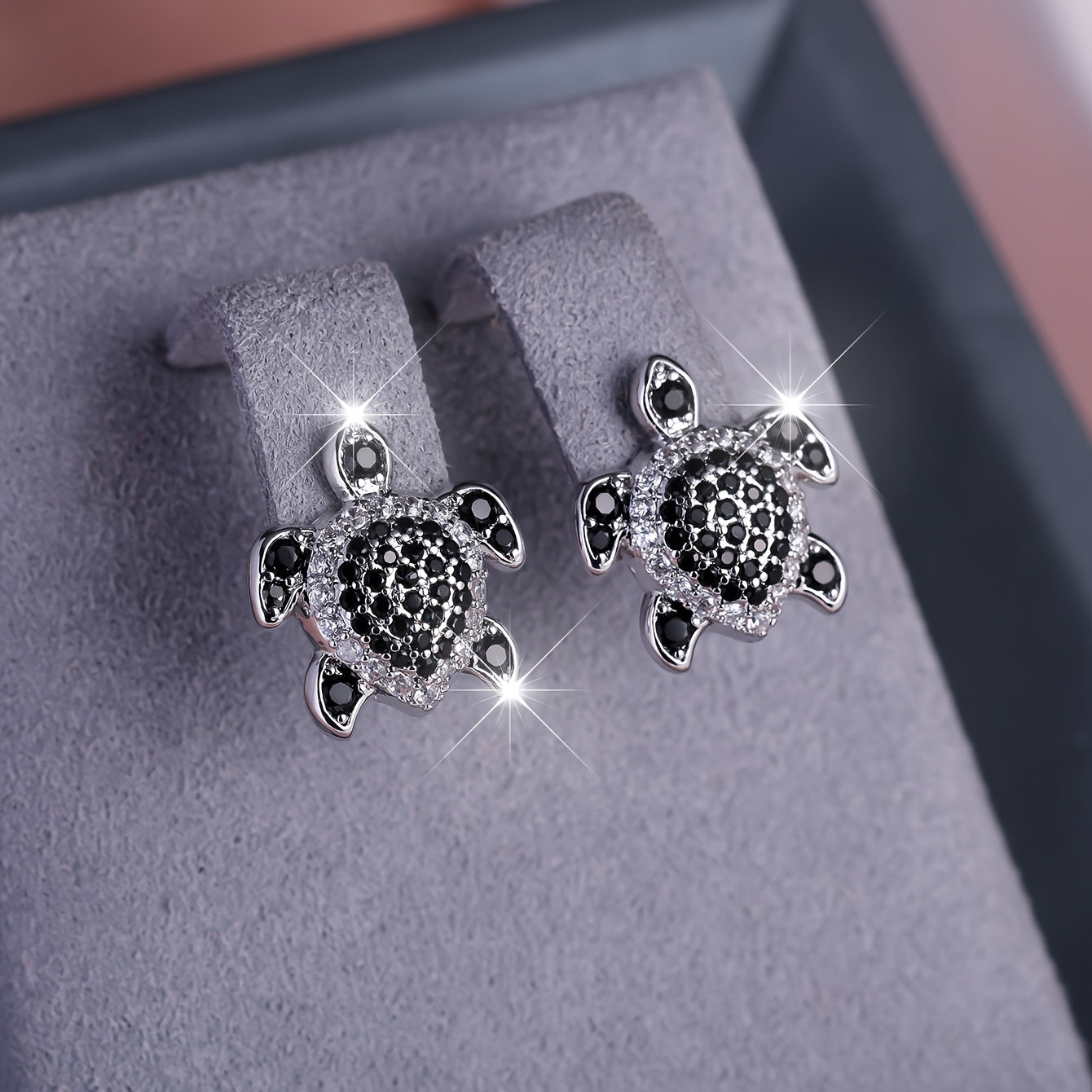 Elegant tortoise earrings adorned with black and white Zirconia, perfect for grand parties and events