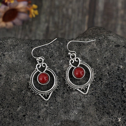 Retro-style silver synthetic gemstone stud earrings, zinc alloy iron earrings, elegant hollow design, suitable for daily wear