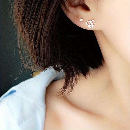 Hollow silver heart-shaped buckle stud earrings, cute and simple style, copper and silver plated jewelry, suitable for daily casual wear