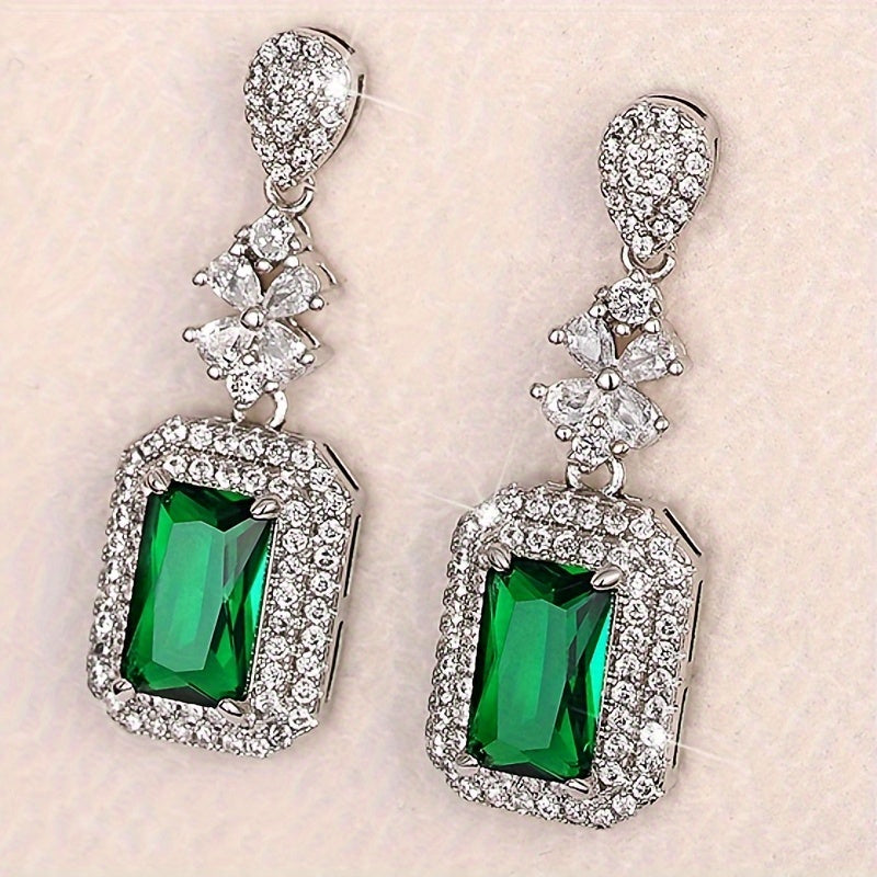 The elegant earrings, made of luxurious sparkling faux zircon and vintage emeralds, are perfect for women to wear at engagement parties and formal events, showcasing the fine craftsmanship found in fashion jewelry.