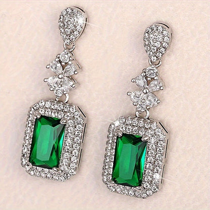 The elegant earrings, made of luxurious sparkling faux zircon and vintage emeralds, are perfect for women to wear at engagement parties and formal events, showcasing the fine craftsmanship found in fashion jewelry.