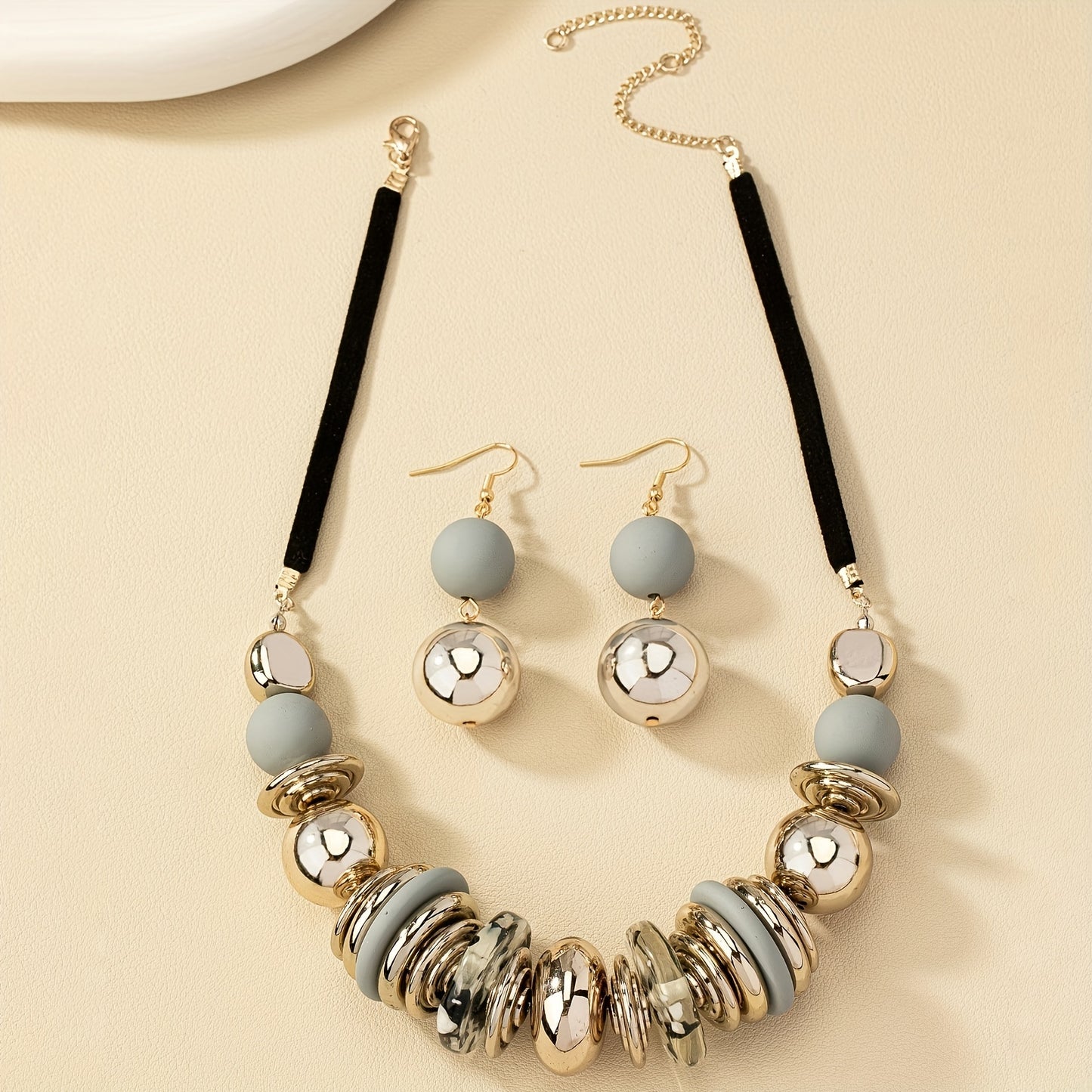 A three-piece necklace plus earrings bohemian jewelry set made of exaggerated beads is the perfect decoration for a summer beach party