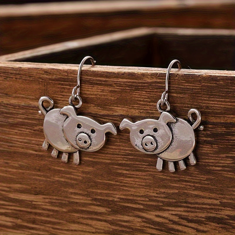 A pair of bohemian vintage pig-shaped pendant earrings, 925 silver-plated copper hooks, and charming animal jewelry for Casual Attire and gift giving, perfect for the Christmas season.