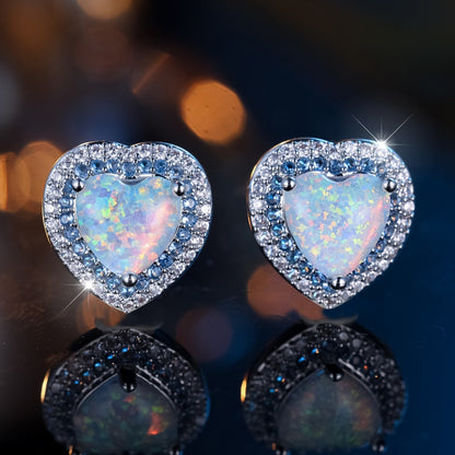 A pair of elegant and luxurious heart-shaped synthetic jade earrings for women as a wedding, party or jewelry gift.