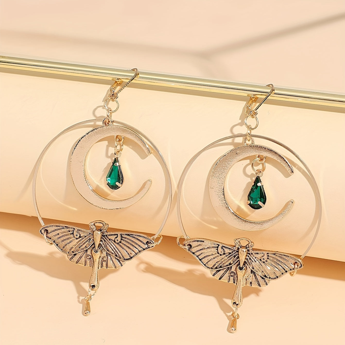A pair of vintage crescent stud earrings with a green resin moth pendant, zinc alloy, and iron pillars for everyday wear jewelry in all seasons