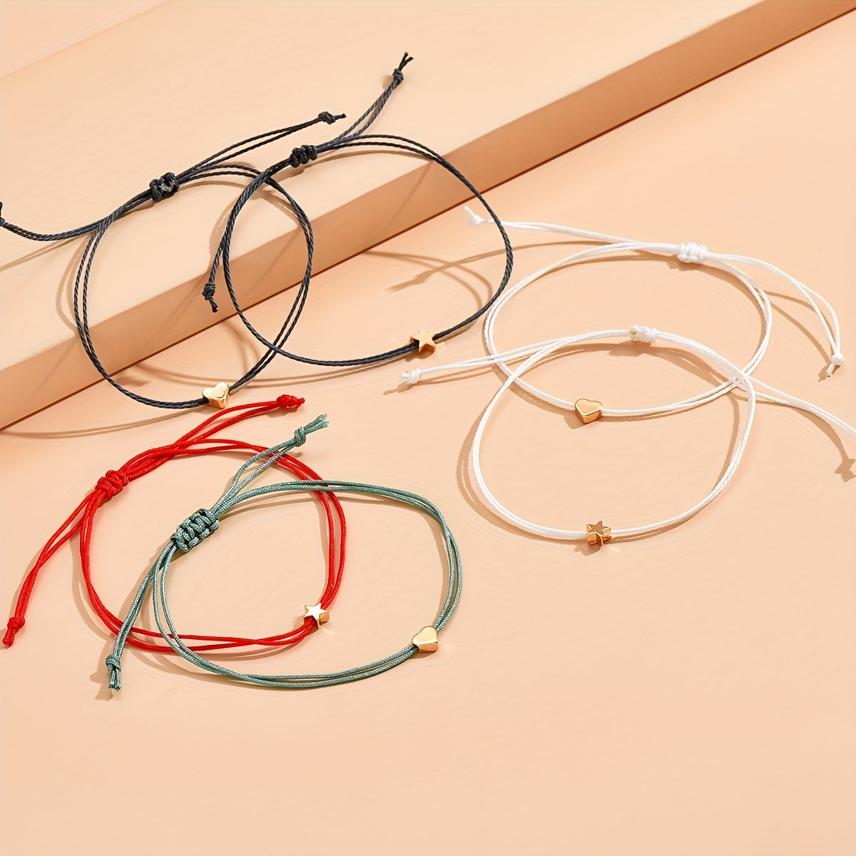 6-Piece bracelet with beads in the shape of hearts and stars