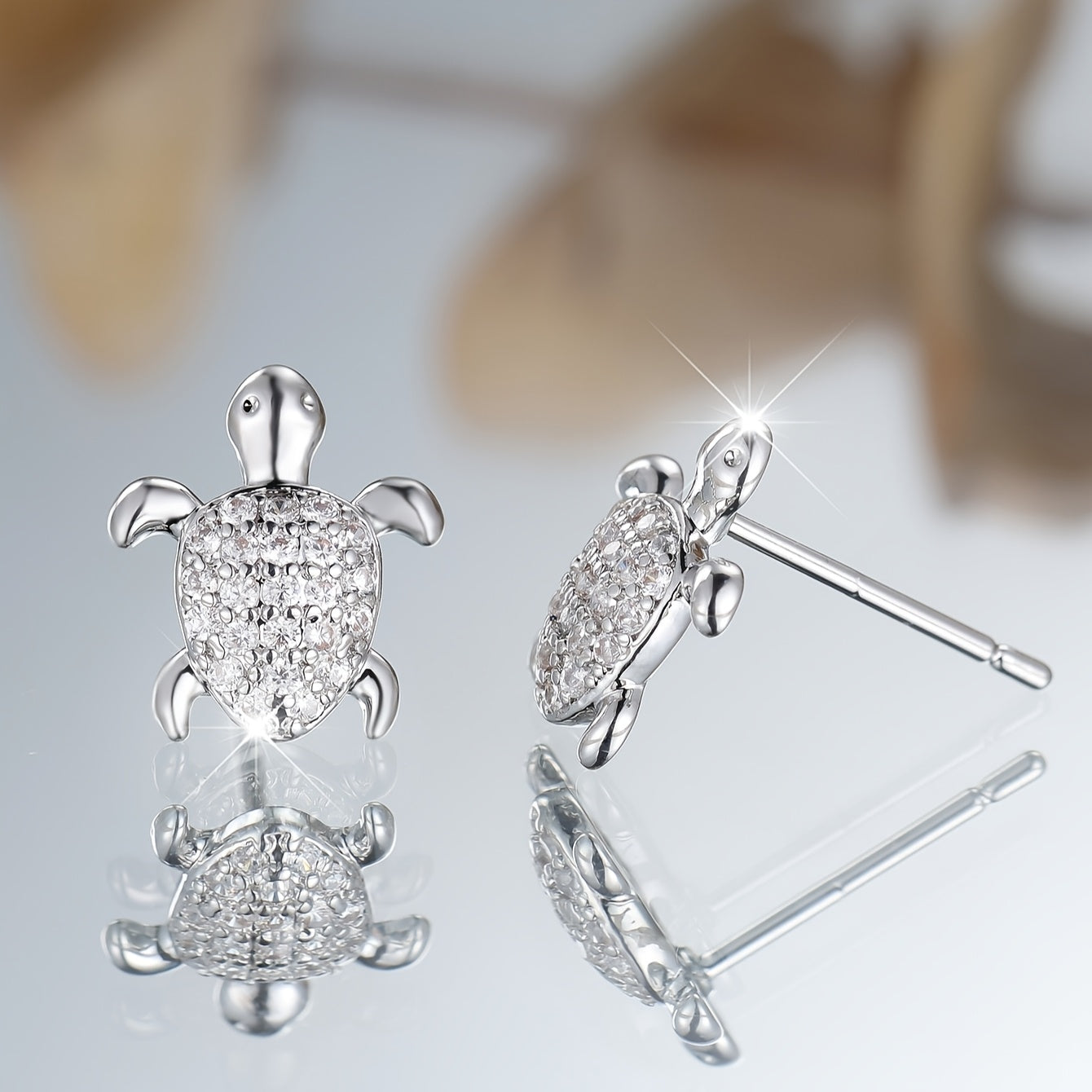 A cute pair of women's turtle earrings - elegant bohemian with shiny square zircon and copper - perfect for weddings, parties and beachfront attire