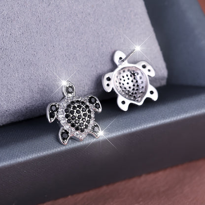 Elegant tortoise earrings adorned with black and white Zirconia, perfect for grand parties and events