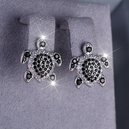 Elegant tortoise earrings adorned with black and white Zirconia, perfect for grand parties and events