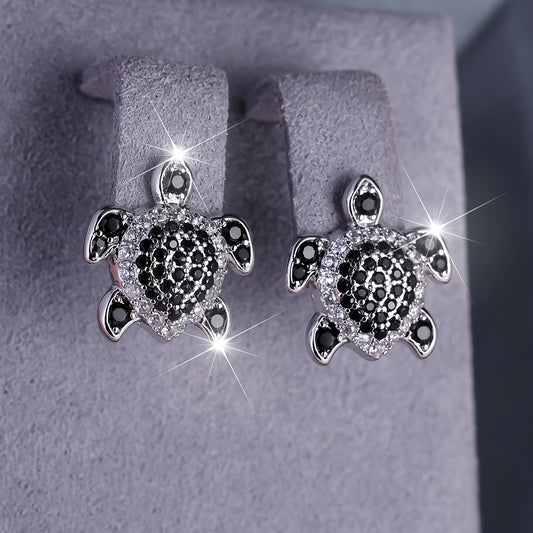Elegant tortoise earrings adorned with black and white Zirconia, perfect for grand parties and events