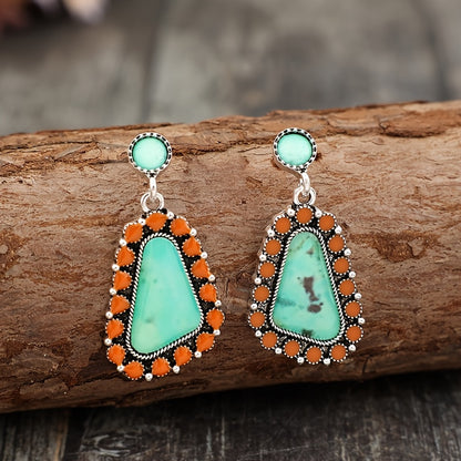 A pair of Bohemian geometric resin stickers with ethnic stylish alloy earrings.