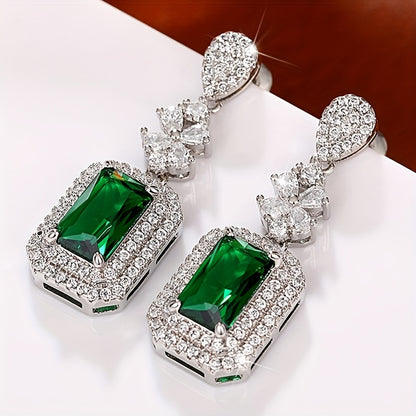 The elegant earrings, made of luxurious sparkling faux zircon and vintage emeralds, are perfect for women to wear at engagement parties and formal events, showcasing the fine craftsmanship found in fashion jewelry.
