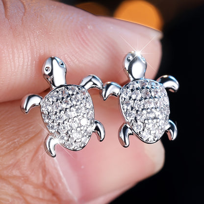 A cute pair of women's turtle earrings - elegant bohemian with shiny square zircon and copper - perfect for weddings, parties and beachfront attire