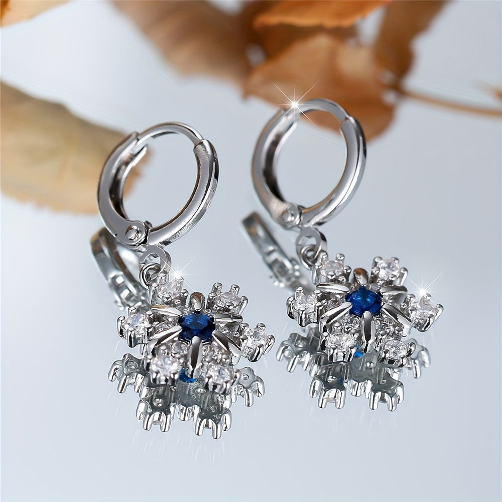 A pair of copper snowflake stud earrings with blue synthetic Zirconia, winter luxury fashion jewelry, suitable for women, cute fringed long stud earrings, suitable for Christmas and Valentine's Day
