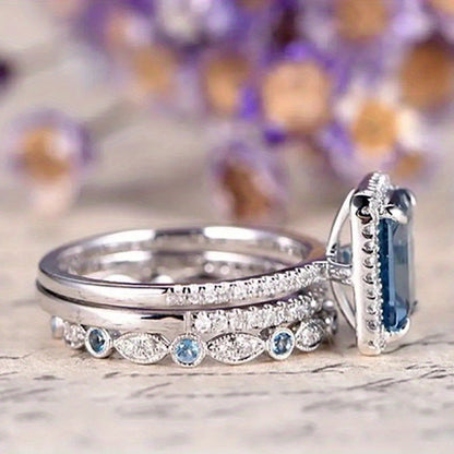 A set of three wedding rings, specially designed for brides, with a four-claw setting and square aquamarine synthetic gemstones, perfect for engagement parties and fashion jewelry.