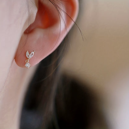 A pair of elegant copper drip earrings with synthetic Zirconia, April birthstone, and simple nickel-free stud earrings for everyday and vacation wear