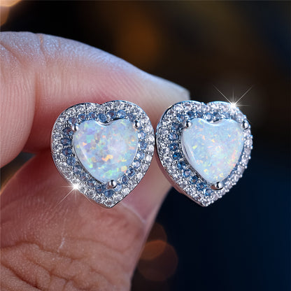 A pair of elegant and luxurious heart-shaped synthetic jade earrings for women as a wedding, party or jewelry gift.