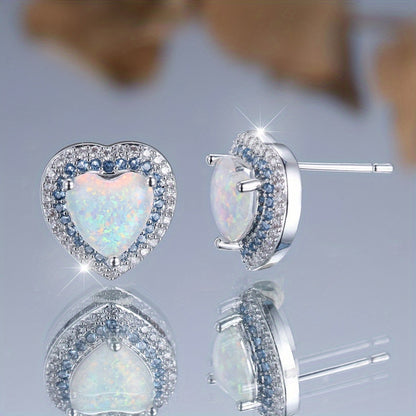 A pair of elegant and luxurious heart-shaped synthetic jade earrings for women as a wedding, party or jewelry gift.