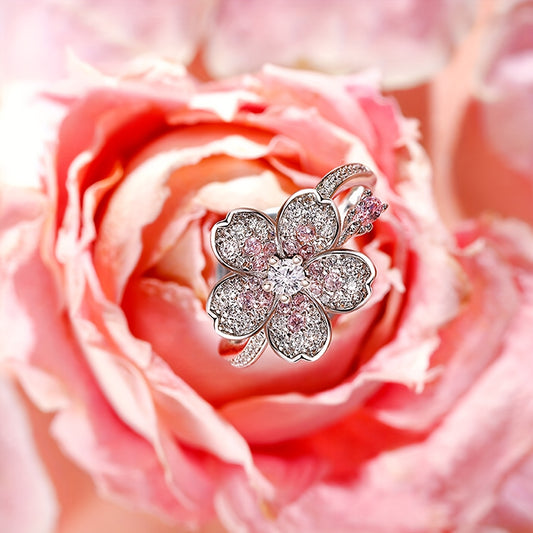A ring of white Zirconia flowers and pink Zirconia rings. A lady's engagement ring for her Valentine's Day gift.