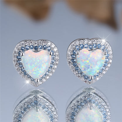 A pair of elegant and luxurious heart-shaped synthetic jade earrings for women as a wedding, party or jewelry gift.