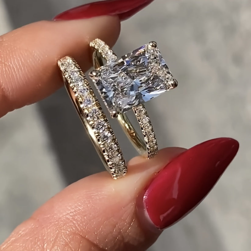 A set of square white Zirconia rings, a two-piece Women's fashion set, and jewelry suitable for holiday parties.