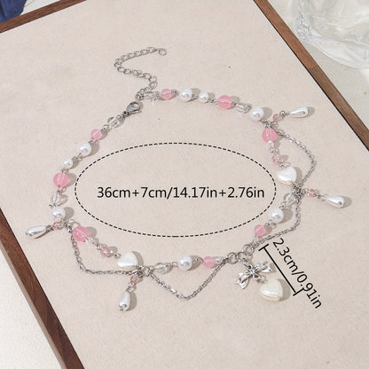 An elegant Y2K-style necklace with a butterfly bow and heart-shaped pendant, imitation pearl tassels, and cute fashion accessories for parties, birthdays, and holidays