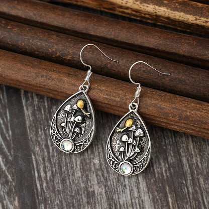 A pair of retro moonstone teardrop mushroom stud earrings, fashionable alloy drip earrings, with artificial analog gemstones and iron ear needles, suitable for women, suitable for over 15 years old
