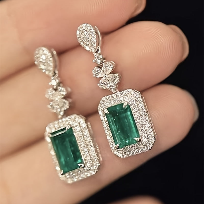 The elegant earrings, made of luxurious sparkling faux zircon and vintage emeralds, are perfect for women to wear at engagement parties and formal events, showcasing the fine craftsmanship found in fashion jewelry.