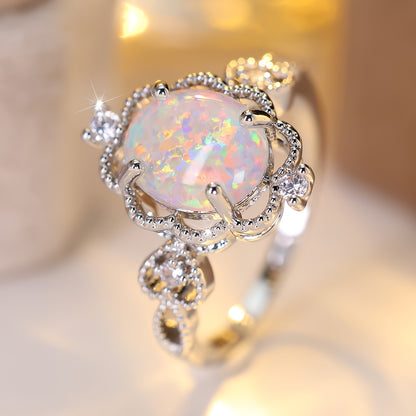 An elegant bohemian-style copper engagement ring with white synthetic opal and cubic Zirconia trim and gold-plated jewelry for weddings and parties